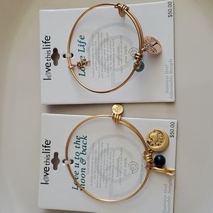 Two bracelets.  Stainless steel adjustable